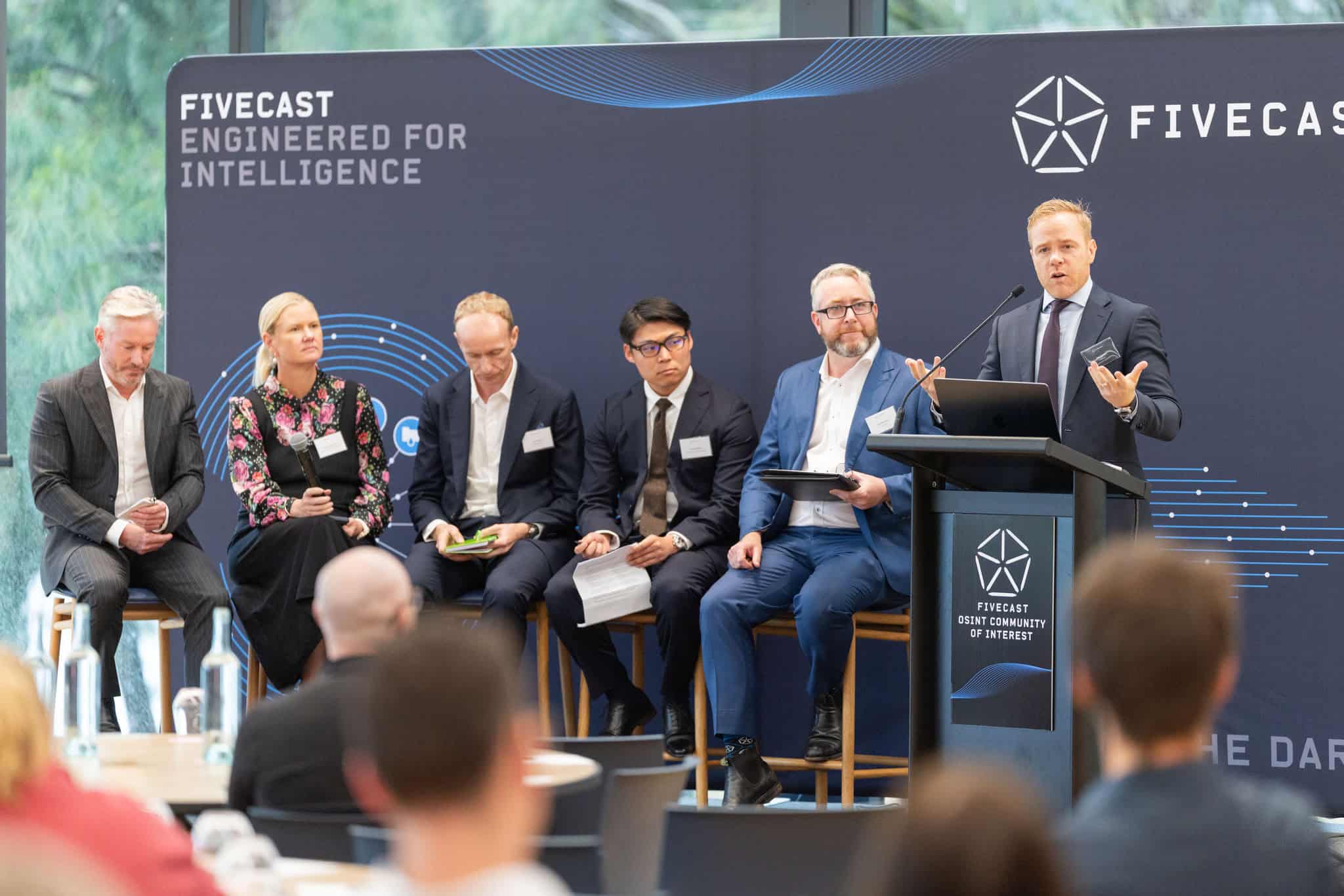 Speakers on stage during a panel discussion at Fivecast Illuminate